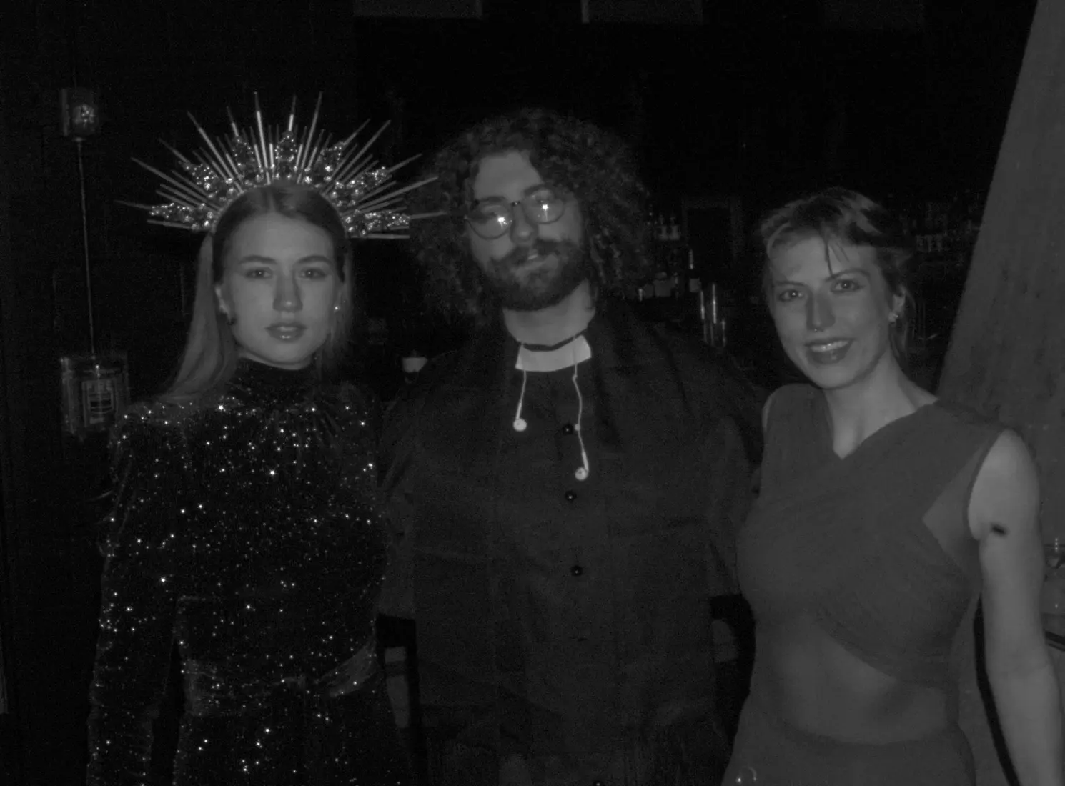 Three young artists together at night