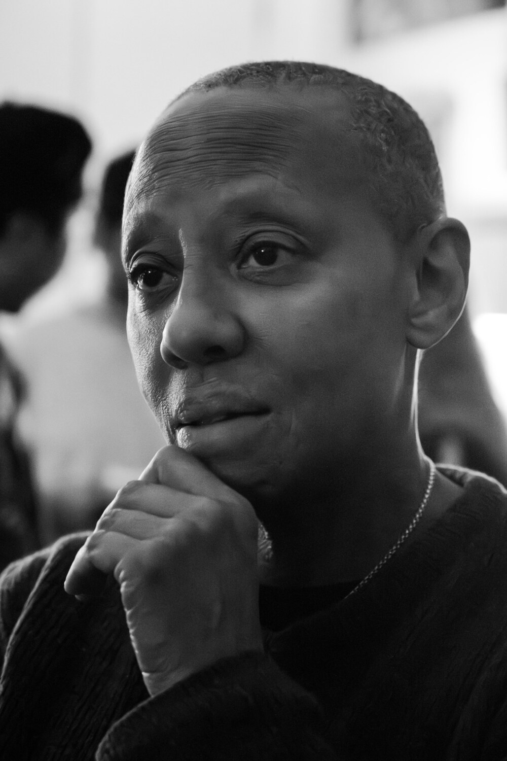 A thoughtful black and white portrait of an artist